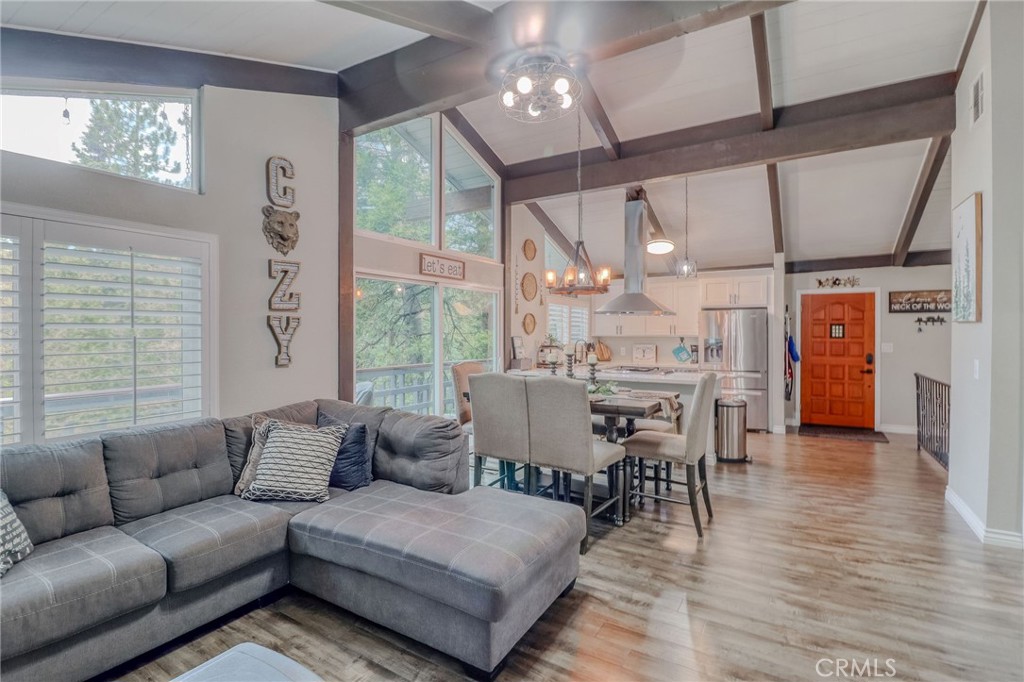 26669 Highway 189 Twin Peaks, CA 92391 - Photo 19 of 68 a living room with furniture and a large window