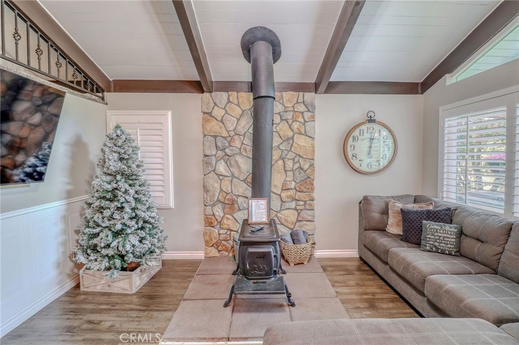 26669 Highway 189 Twin Peaks, CA 92391 - Photo 20 of 68 a living room with furniture and a fireplace