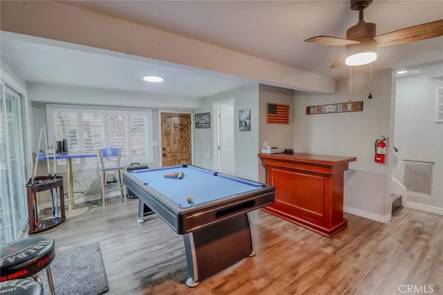 a living room with furniture fireplace and flat screen tv