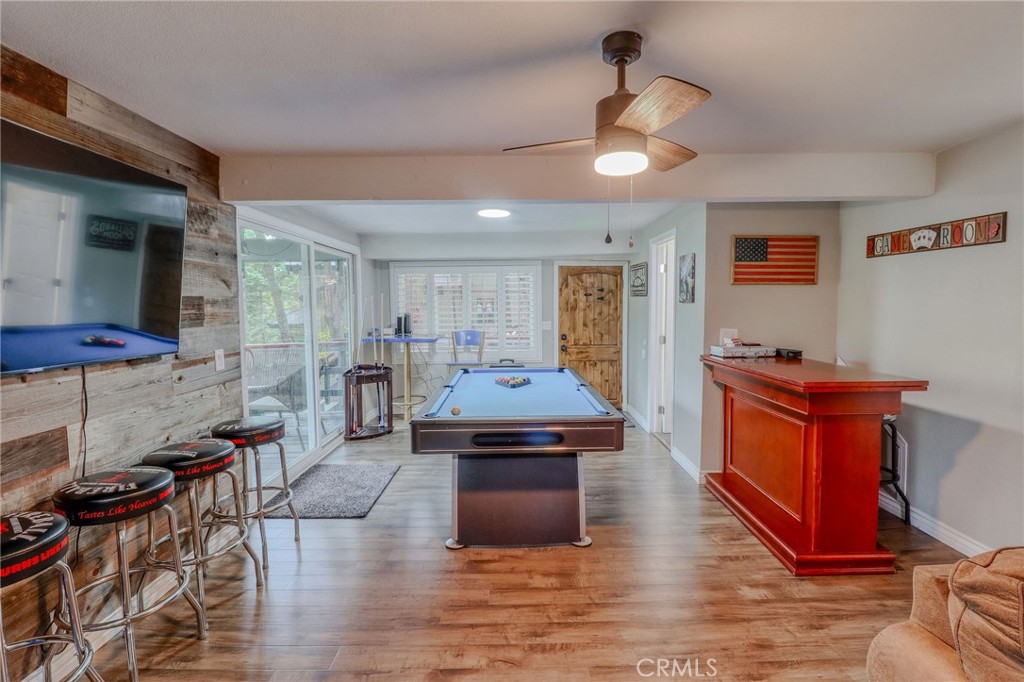 26669 Highway 189 Twin Peaks, CA 92391 - Photo 31 of 68 a kitchen with stainless steel appliances granite countertop a stove and a refrigerator