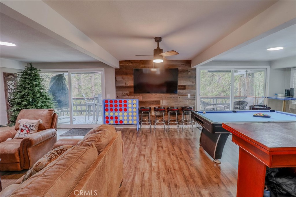 26669 Highway 189 Twin Peaks, CA 92391 - Photo 32 of 68 a living room with furniture and a flat screen tv