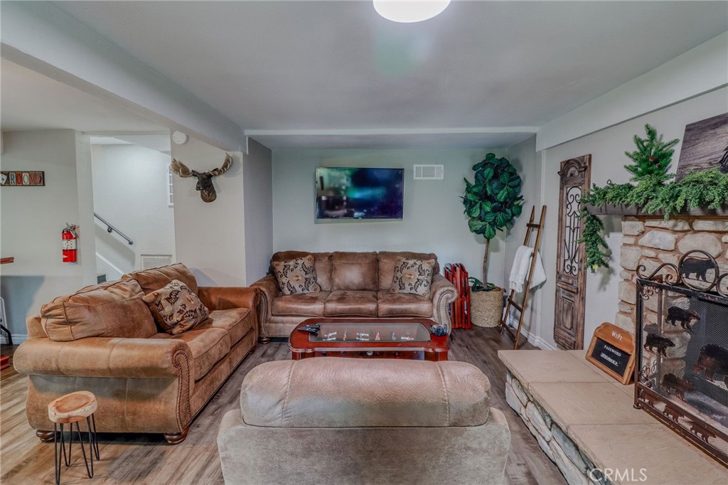 26669 Highway 189 Twin Peaks, CA 92391 - Photo 33 of 68 a living room with furniture and a flat screen tv
