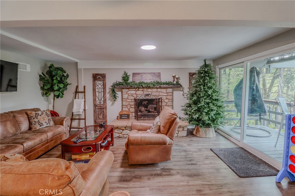 26669 Highway 189 Twin Peaks, CA 92391 - Photo 34 of 68 a living room with furniture and a potted plant