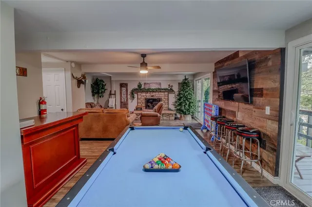 a view of a red chair and table in the balcony