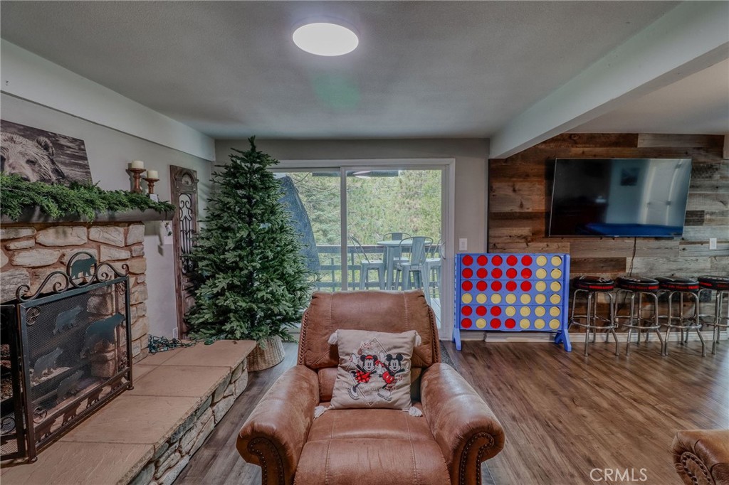 26669 Highway 189 Twin Peaks, CA 92391 - Photo 37 of 68 a living room with furniture fireplace and flat screen tv