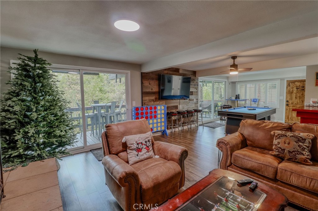 26669 Highway 189 Twin Peaks, CA 92391 - Photo 38 of 68 a living room with furniture fireplace and a large window
