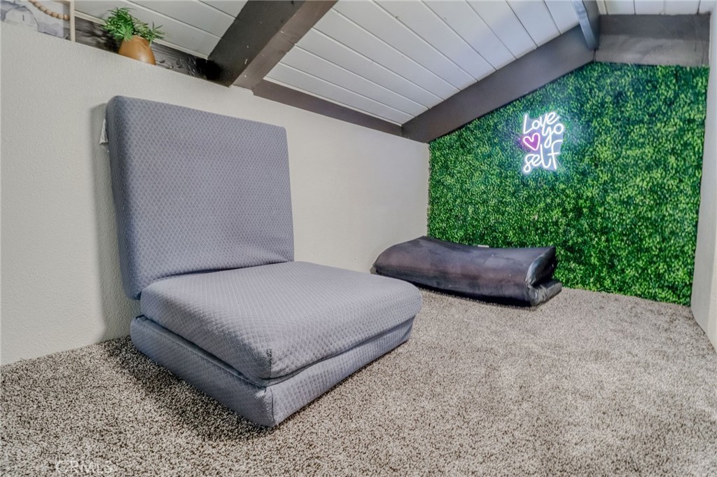 26669 Highway 189 Twin Peaks, CA 92391 - Photo 39 of 68 a bedroom with a bed and a potted plant