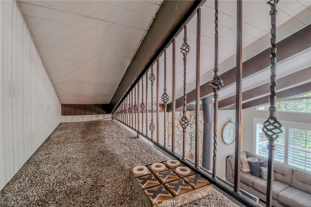 26669 Highway 189 Twin Peaks, CA 92391 - Photo 40 of 68 a view of staircase with railing and white walls