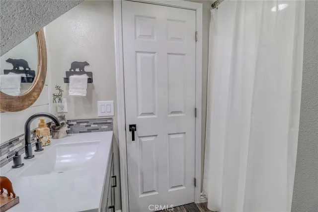 a balcony with furniture and wooden floor