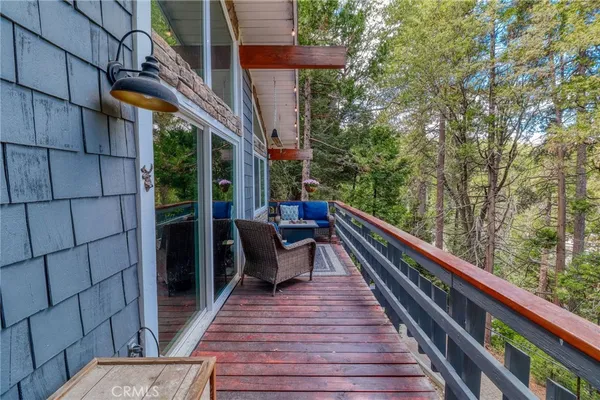 a view of a backyard with sitting area