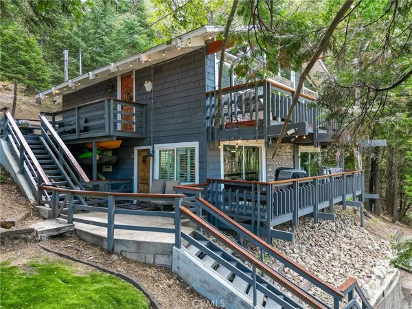 a view of a house with a deck and wooden floor