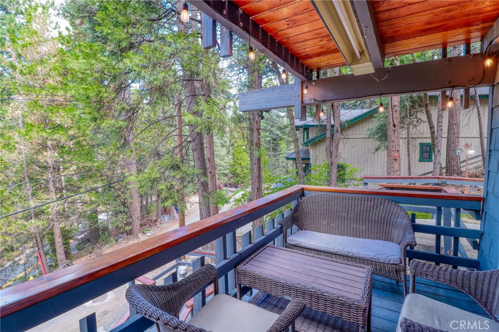 26669 Highway 189 Twin Peaks, CA 92391 - Photo 59 of 68 a view of a two chairs in the deck next to a yard