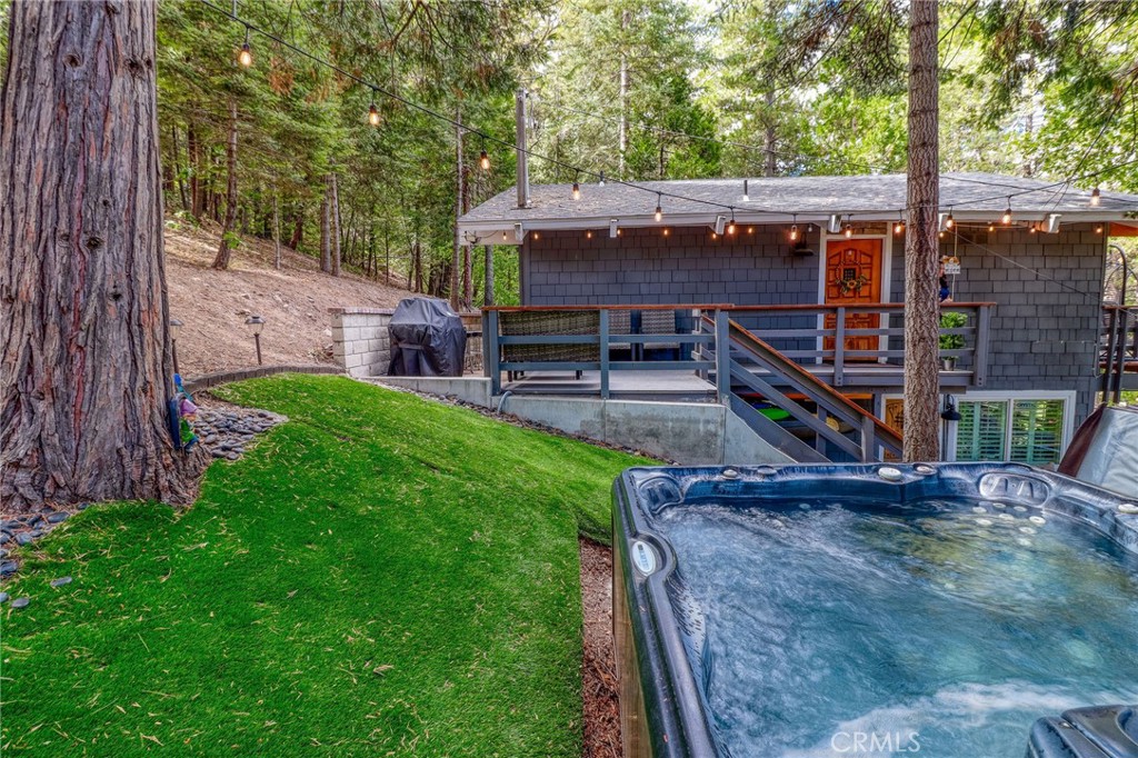 26669 Highway 189 Twin Peaks, CA 92391 - Photo 61 of 68 a view of a deck with a big yard potted plants and large tree