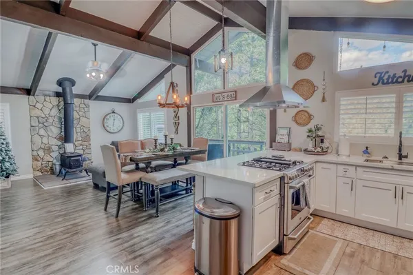 a kitchen with a sink stove and cabinets