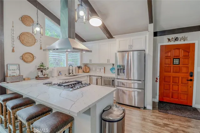 a dining room with furniture and wooden floor
