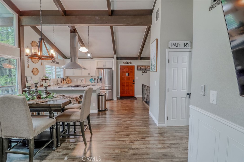 26669 Highway 189 Twin Peaks, CA 92391 - Photo 10 of 68 a dining room with furniture and wooden floor