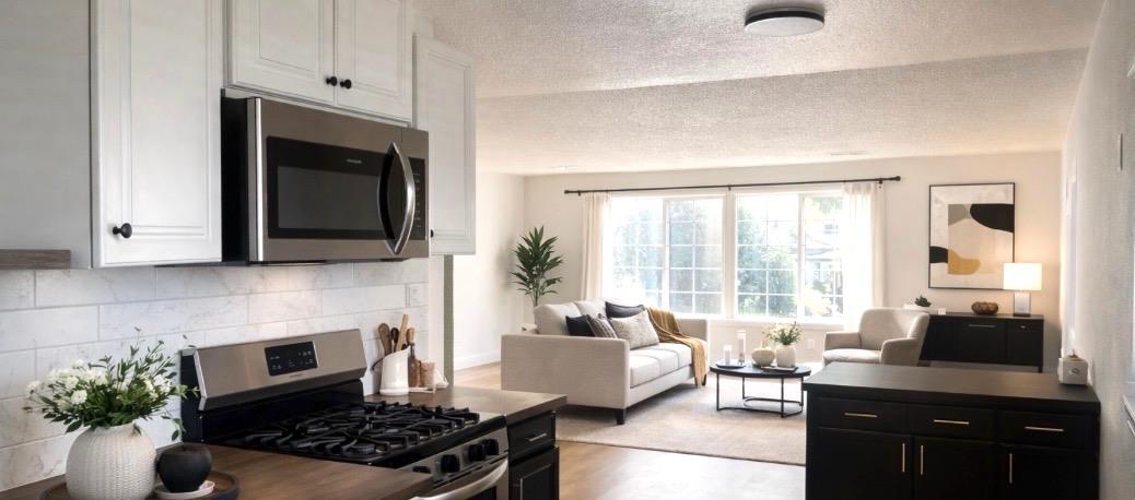 5121 Kenneth Avenue Carmichael, CA 95608 - Photo 17 of 38 a kitchen with stainless steel appliances a stove a sink and a microwave
