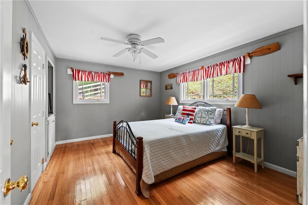 221 Reece Creek Road West Blairsville, GA 30512 - Photo 35 of 42 a room with a bed and a chandelier