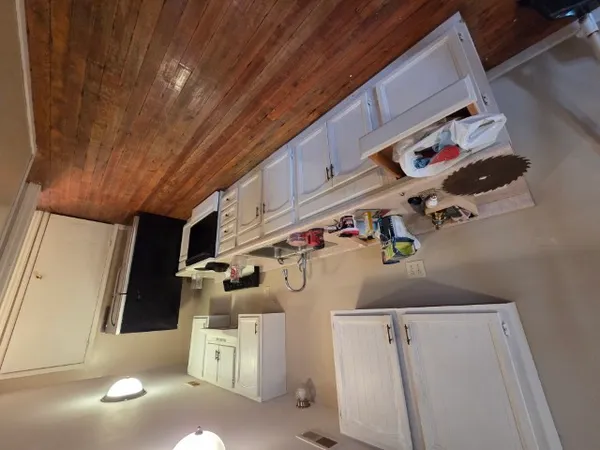 a utility room with cabinets
