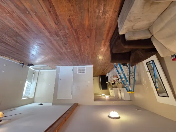a view of a refrigerator with wooden floor