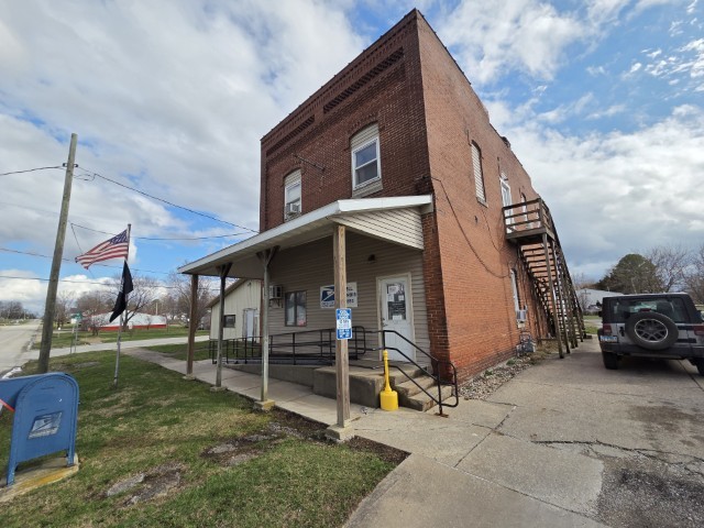 303 3rd Street Kell, IL 62853 - Photo 2 of 23 a view of a house with a yard
