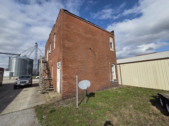 303 3rd Street Kell, IL 62853 - Photo 4 of 23 a backyard of a house with barbeque oven and outdoor seating
