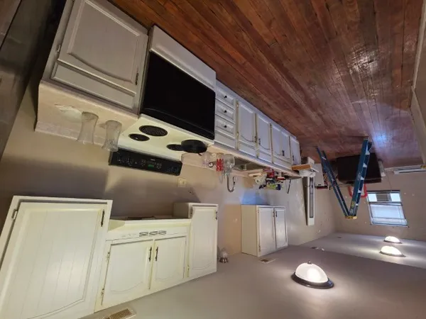 a view of a room with a ceiling fan