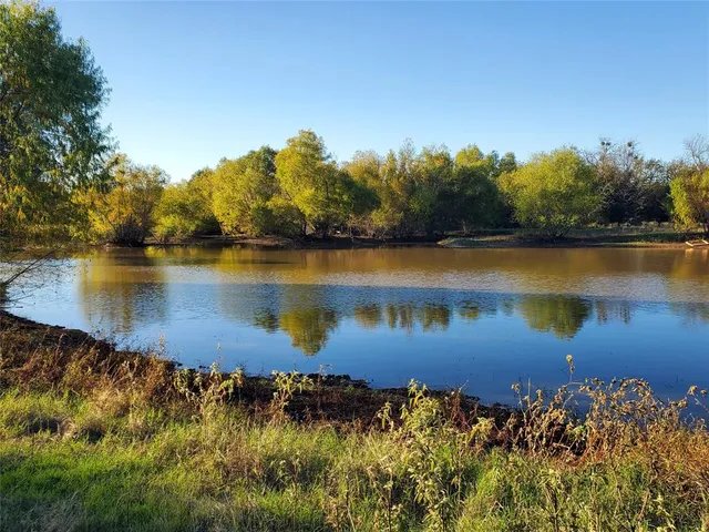 a view of a lake with a building in the background