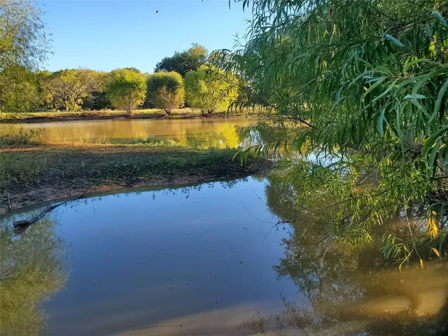 a view of lake with green space