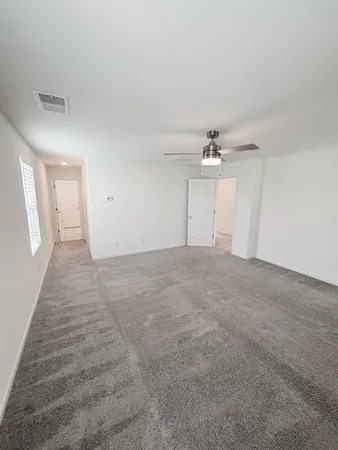 a view of a room with wooden floor and staircase