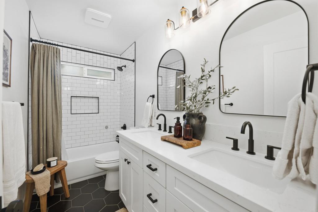 1878 Rancho Jorie Alpine, CA 91901 - Photo 18 of 70 a bathroom with a double vanity sink toilet and shower