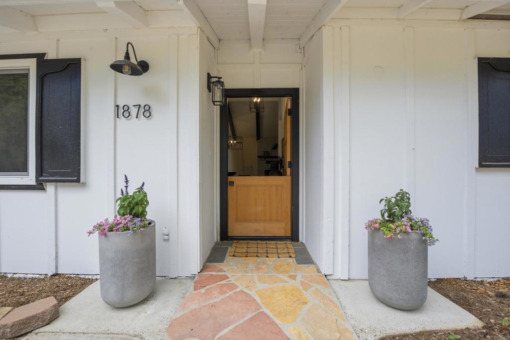 1878 Rancho Jorie Alpine, CA 91901 - Photo 2 of 70 a view of a entryway door and interior of the house