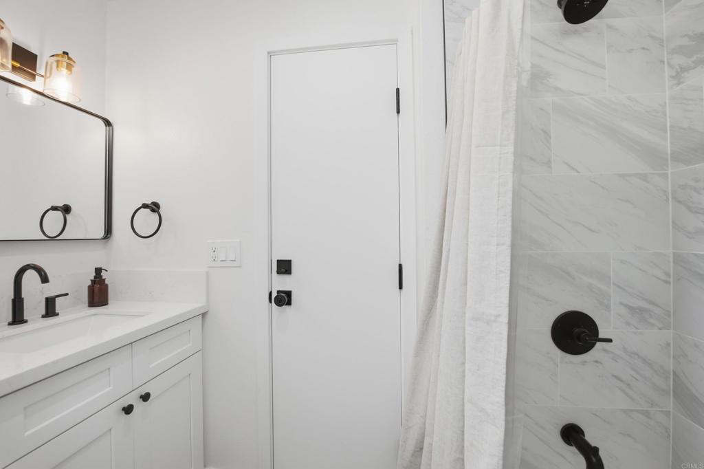 1878 Rancho Jorie Alpine, CA 91901 - Photo 26 of 70 a bathroom with a sink and mirror