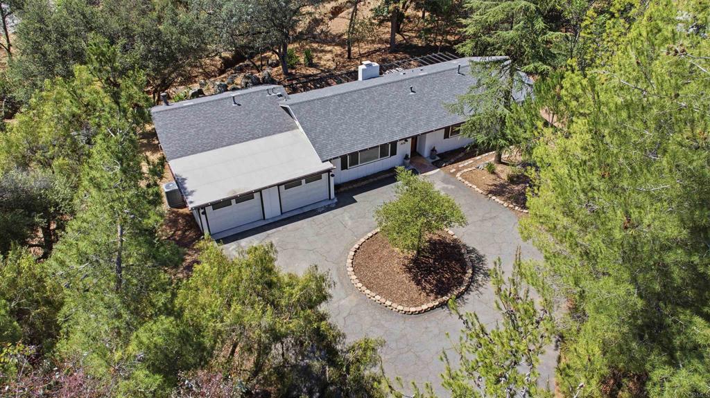 1878 Rancho Jorie Alpine, CA 91901 - Photo 37 of 70 an aerial view of a house with a yard and a large tree