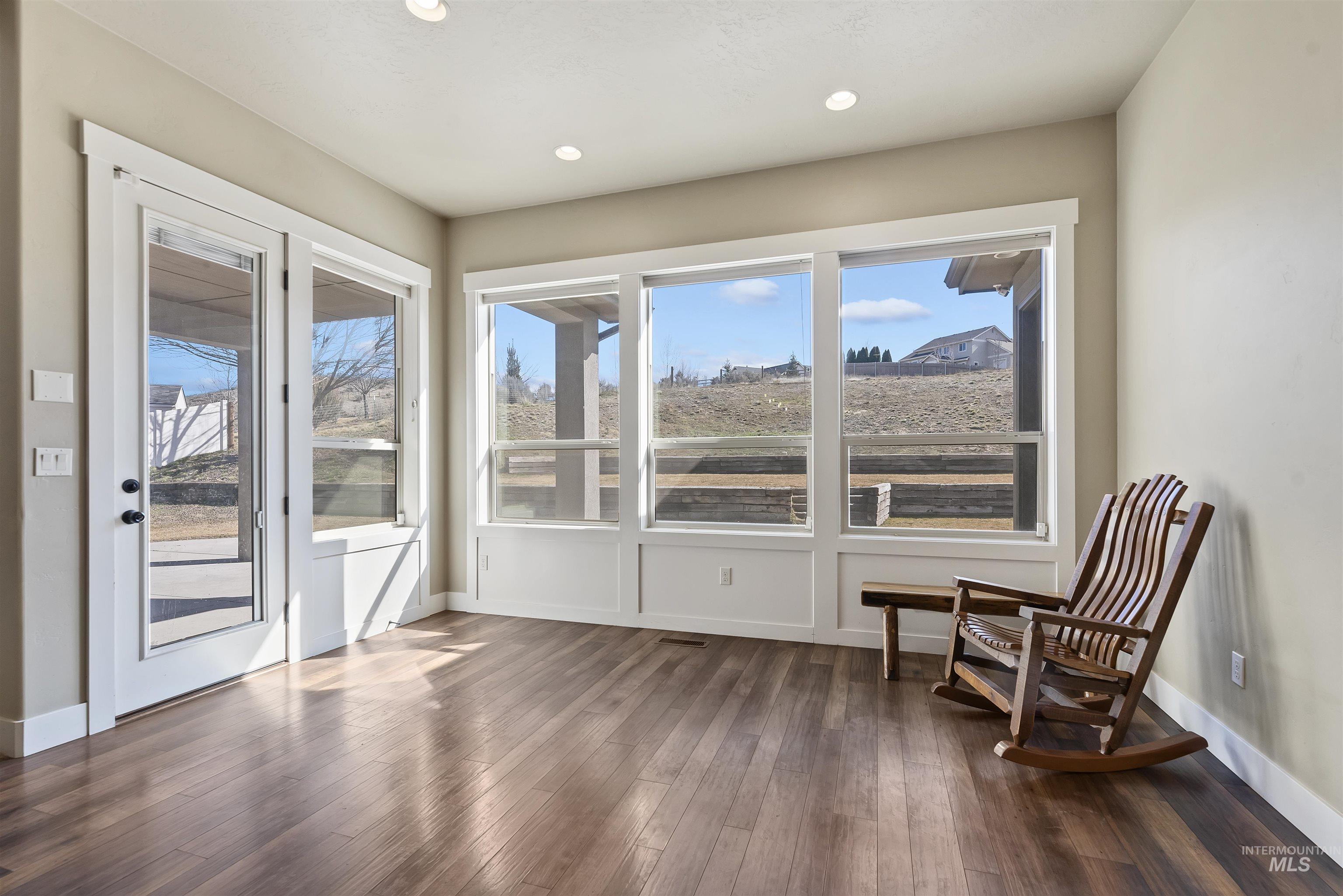 24710 Blessinger Road Star, ID 83669 - Photo 11 of 46 Unfurnished room with dark wood-type flooring and recessed lighting
