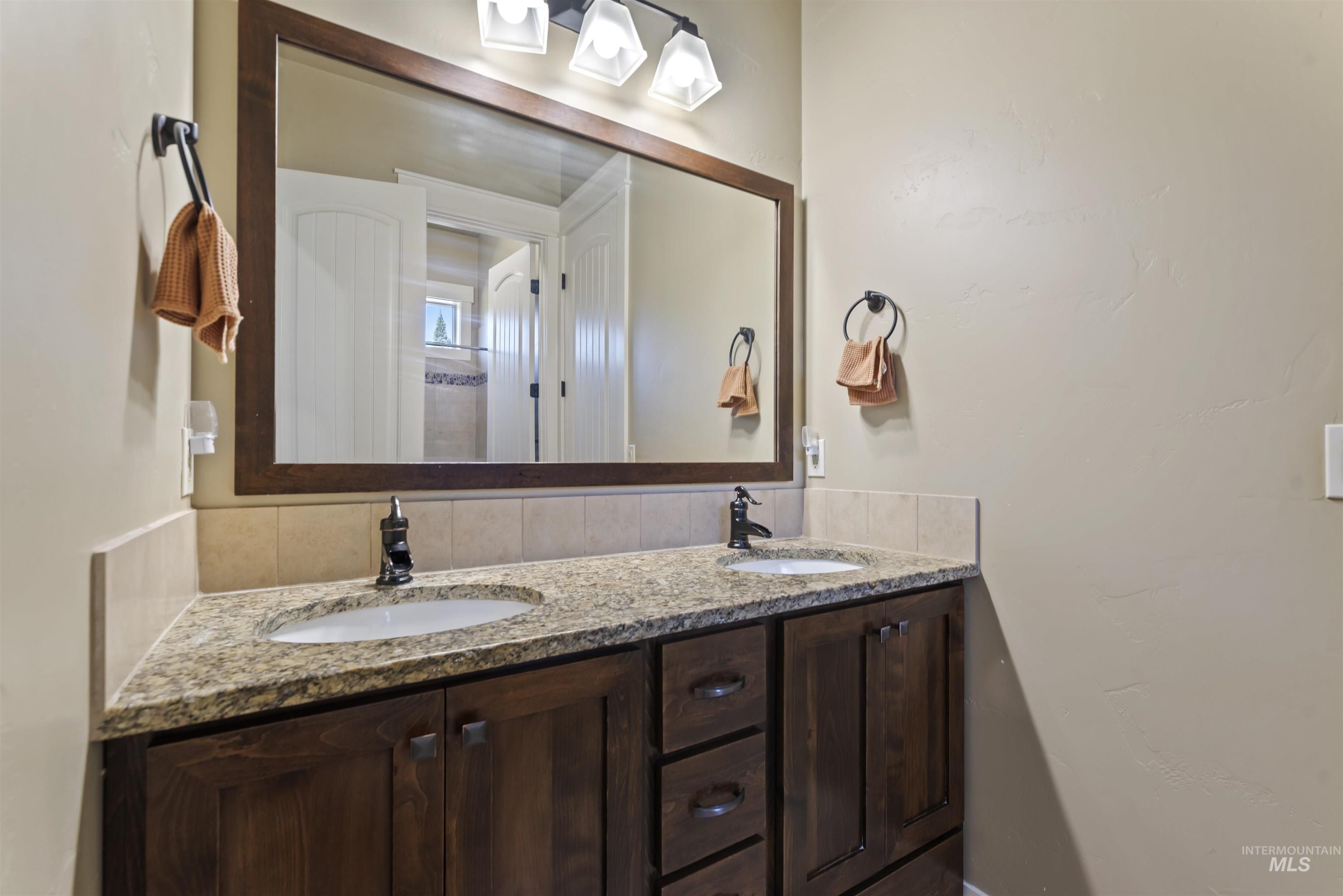 24710 Blessinger Road Star, ID 83669 - Photo 19 of 46 Full bathroom featuring double vanity