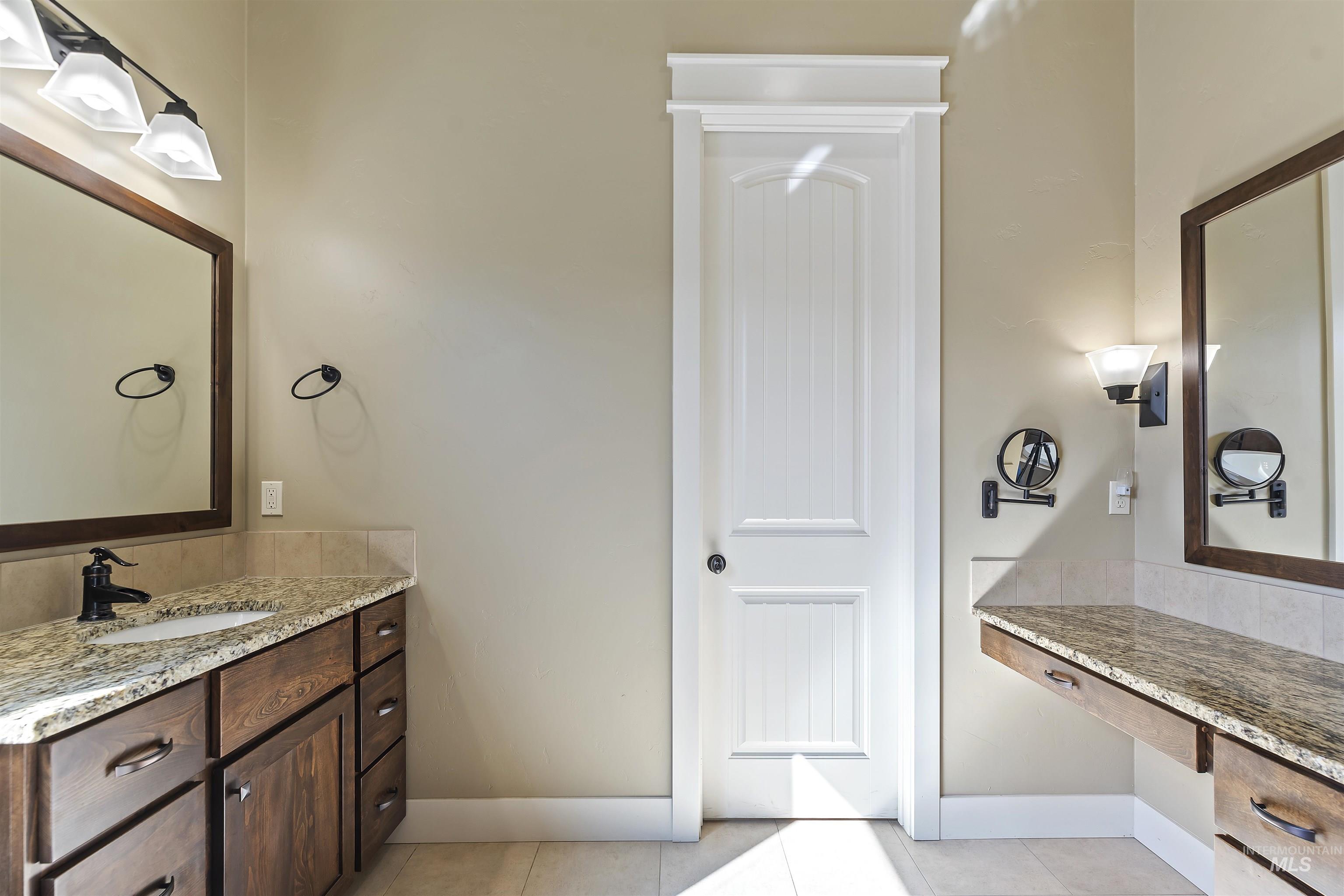24710 Blessinger Road Star, ID 83669 - Photo 22 of 46 Bathroom with vanity and light tile patterned flooring
