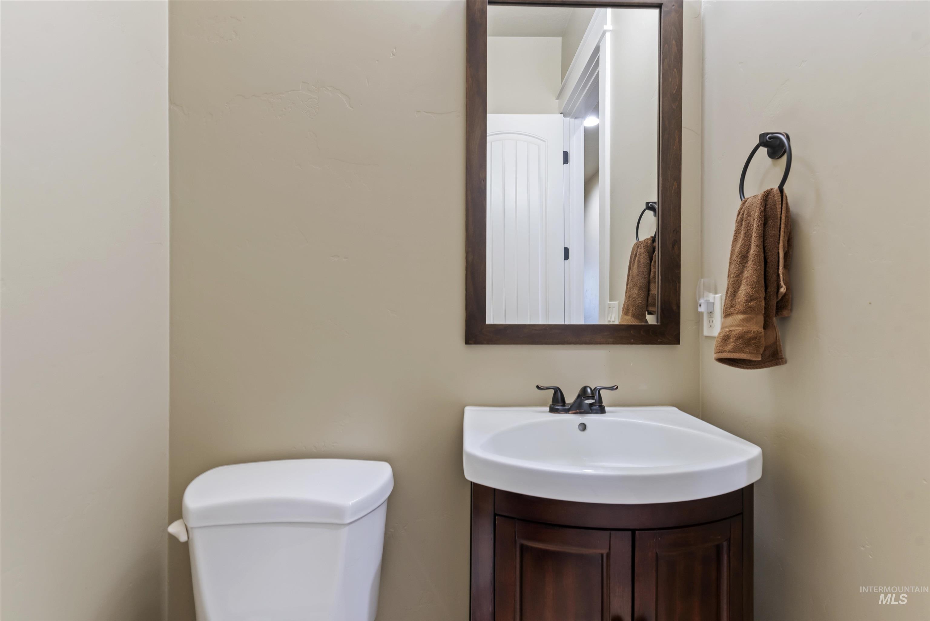 24710 Blessinger Road Star, ID 83669 - Photo 26 of 46 Half bathroom with vanity and toilet