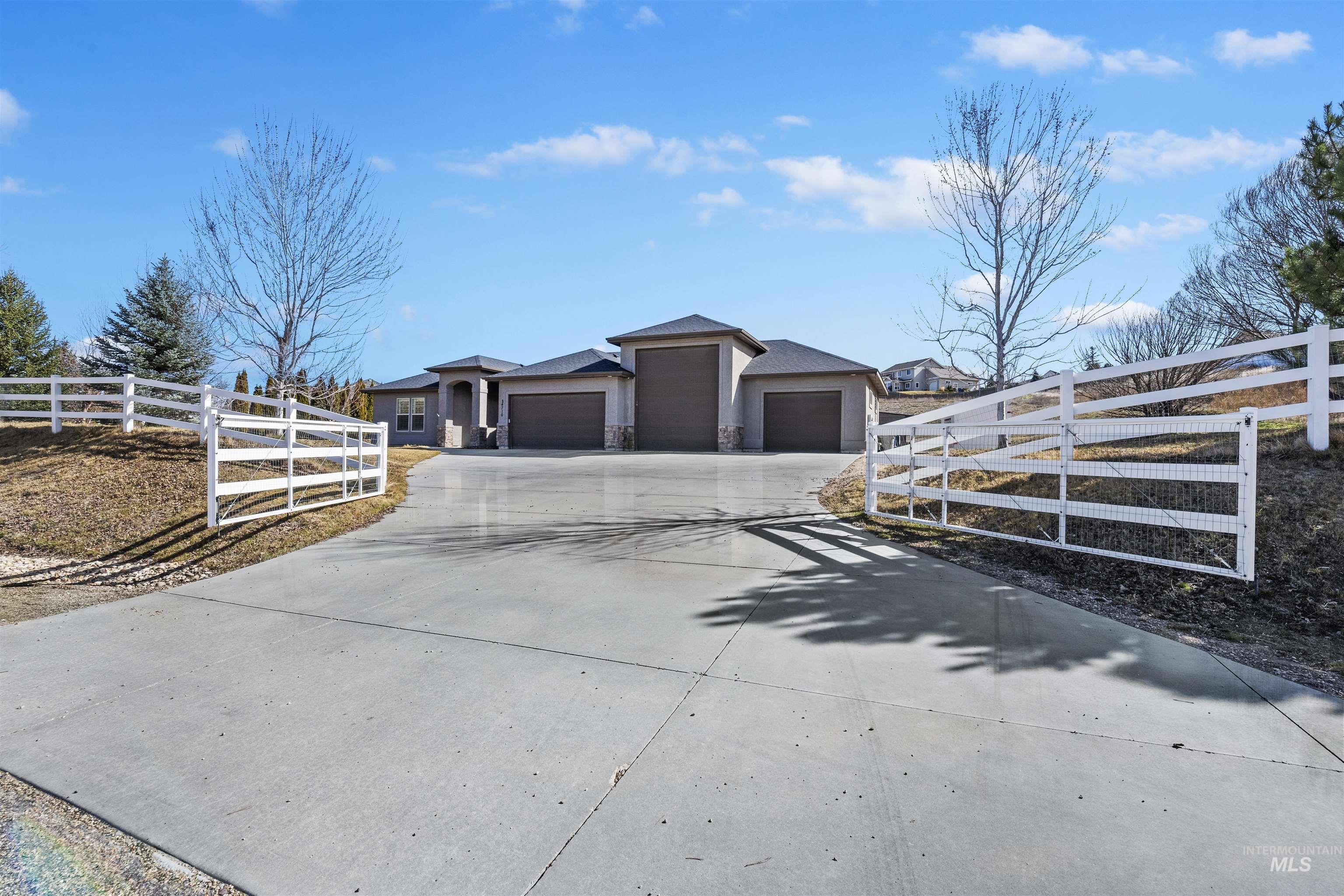 24710 Blessinger Road Star, ID 83669 - Photo 4 of 46 View of front of home featuring a garage and driveway