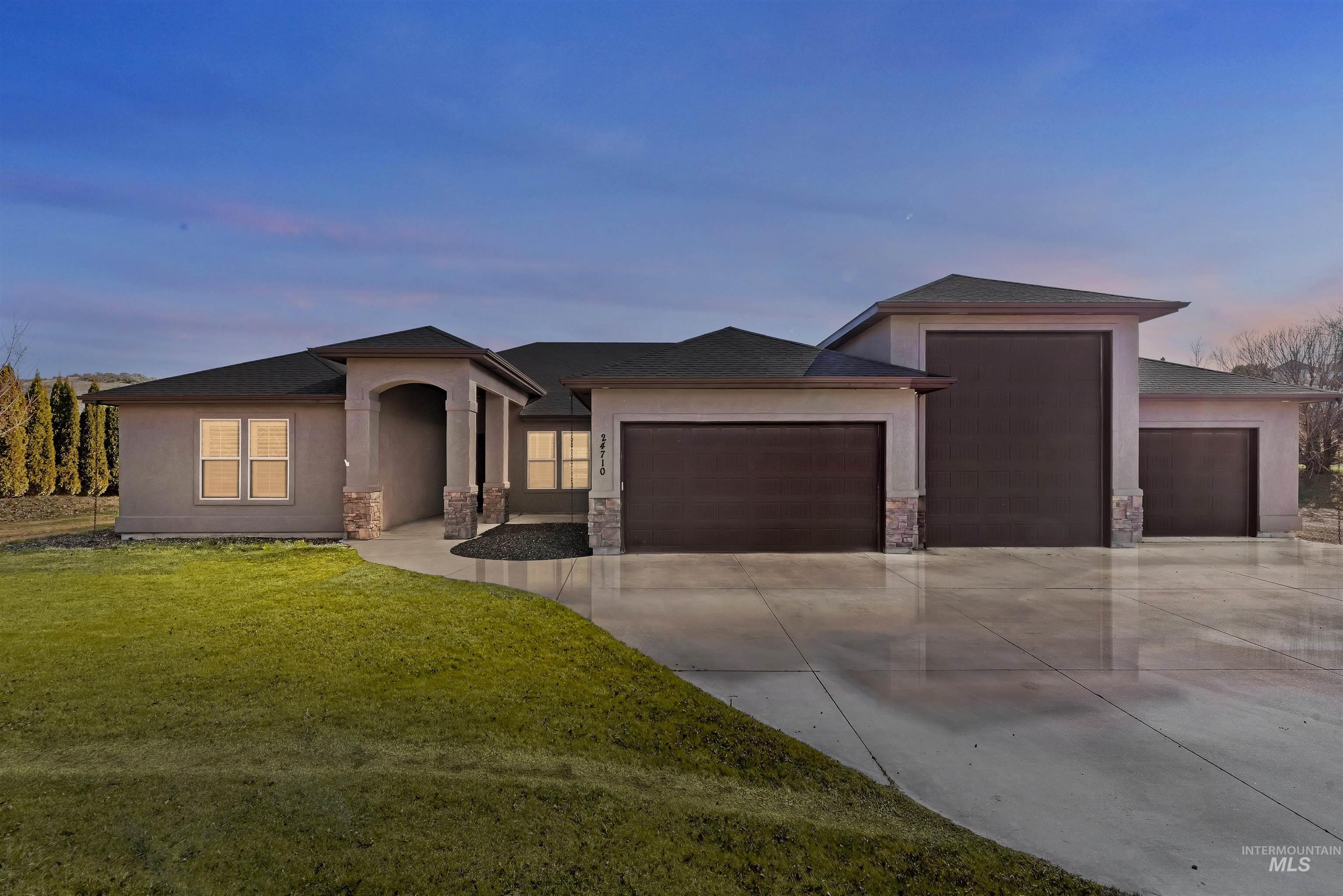 24710 Blessinger Road Star, ID 83669 - Photo 5 of 46 Prairie-style home with a garage, a front yard, and concrete driveway