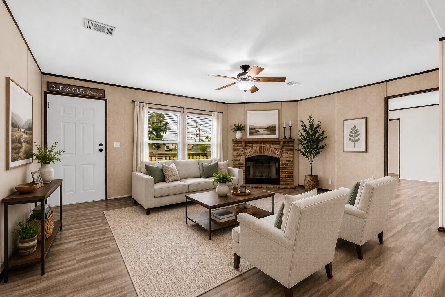 a living room with furniture a fireplace and a flat screen tv
