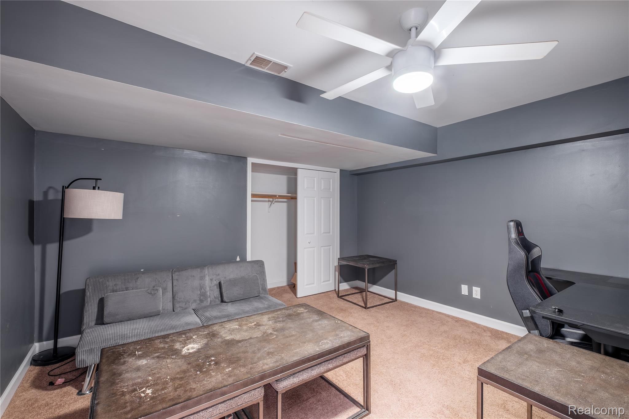 10250 Duffield Road Gaines, MI 48436 - Photo 25 of 28 Recessed lighting, ceiling fan, bi-fold closet doors, and neutral carpeting