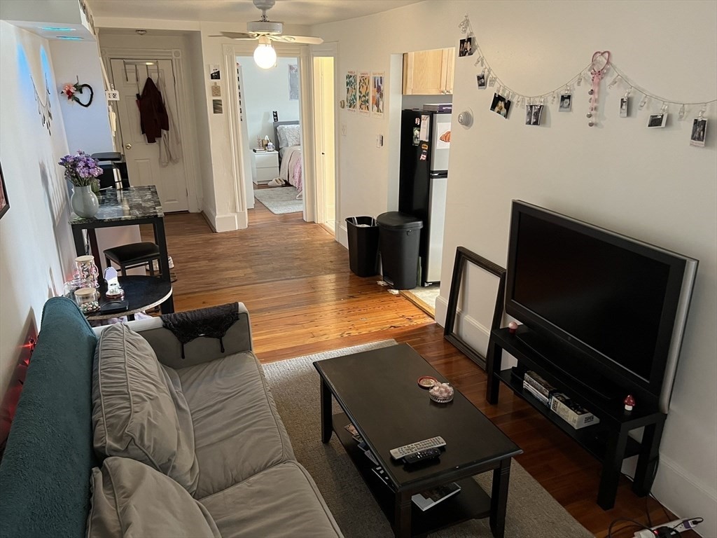 137 Peterborough Street, Unit 31 Boston, MA 02215 - Photo 3 of 14 a living room with furniture and a flat screen tv