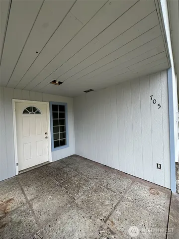 a view of an empty room with a window