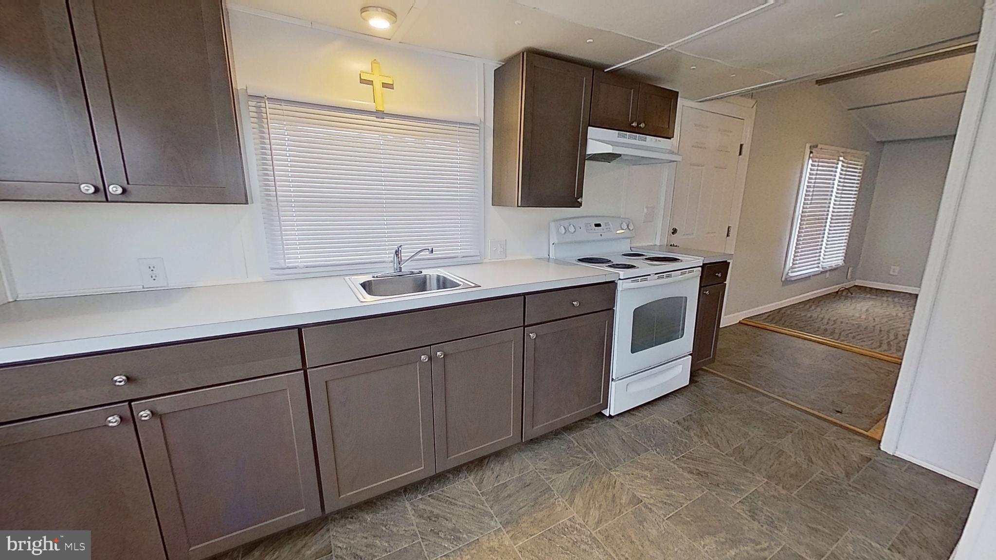 450 Ridge Road, Unit 16 Etters, PA 17319 - Photo 2 of 6 a spacious bathroom with a double vanity sink and mirror