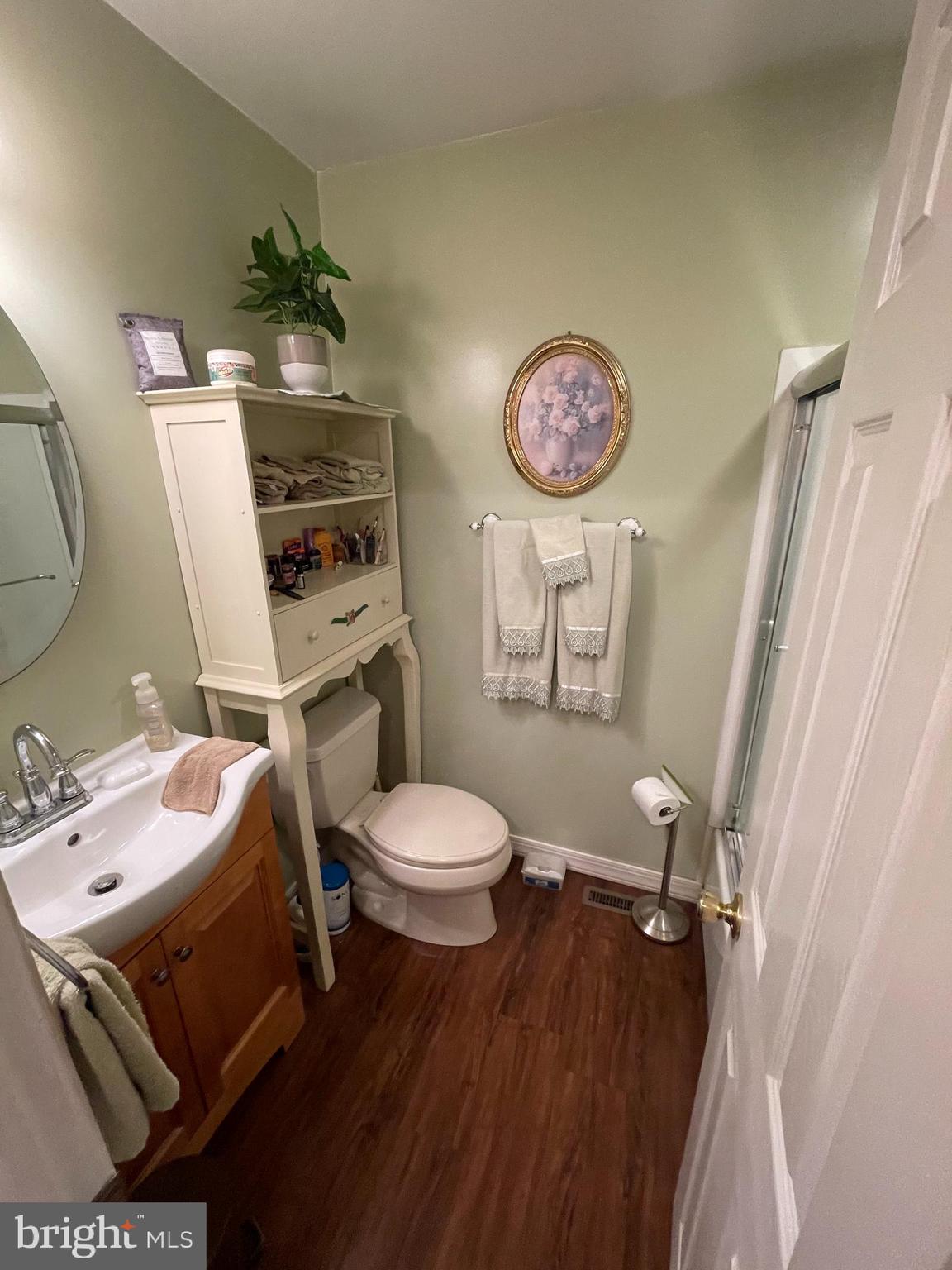 12014 Tyrone Road Philadelphia, PA 19154 - Photo 11 of 32 a bathroom with a sink mirror vanity and toilet