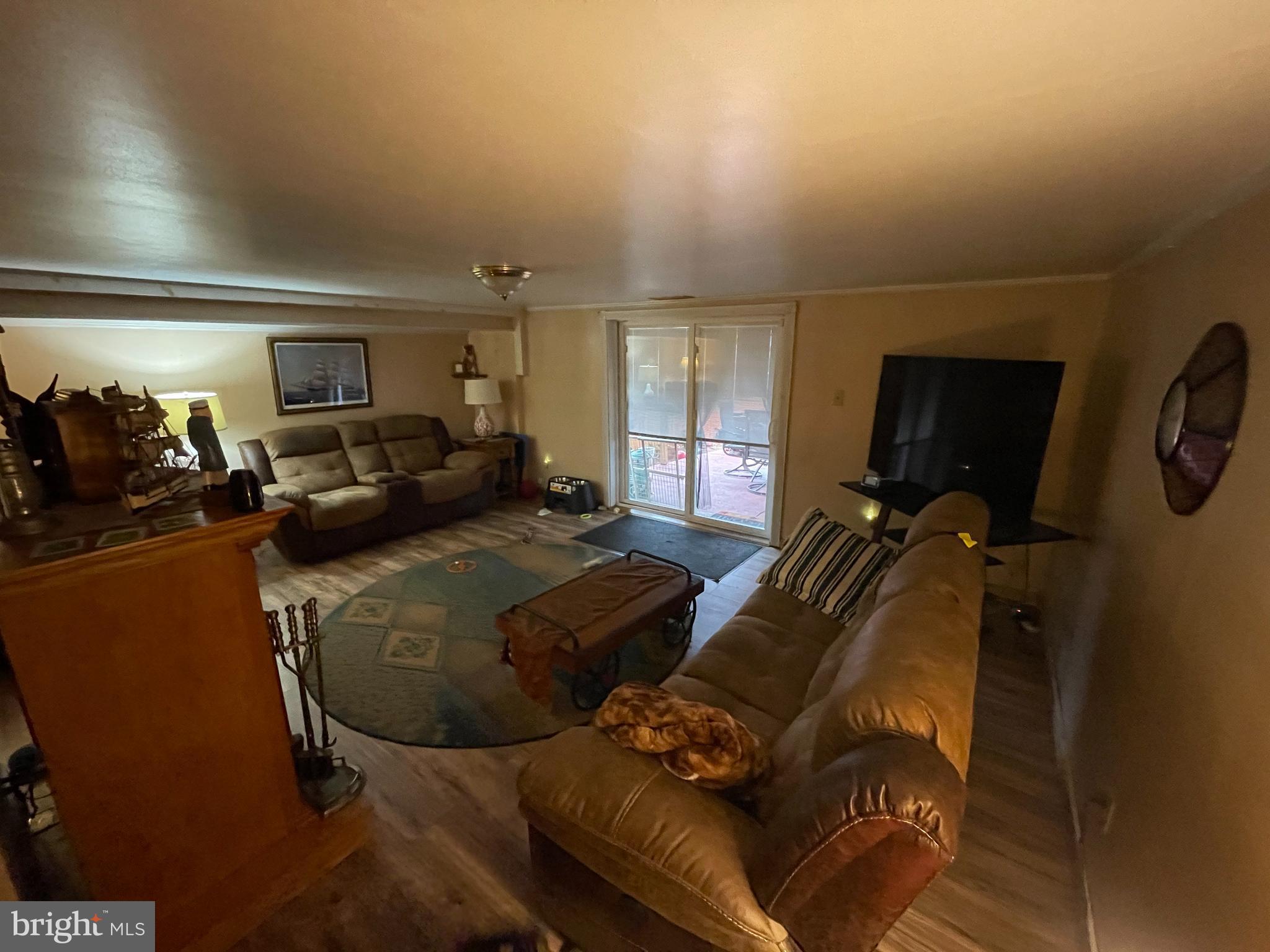 12014 Tyrone Road Philadelphia, PA 19154 - Photo 17 of 32 a living room with furniture gym equipment and a window