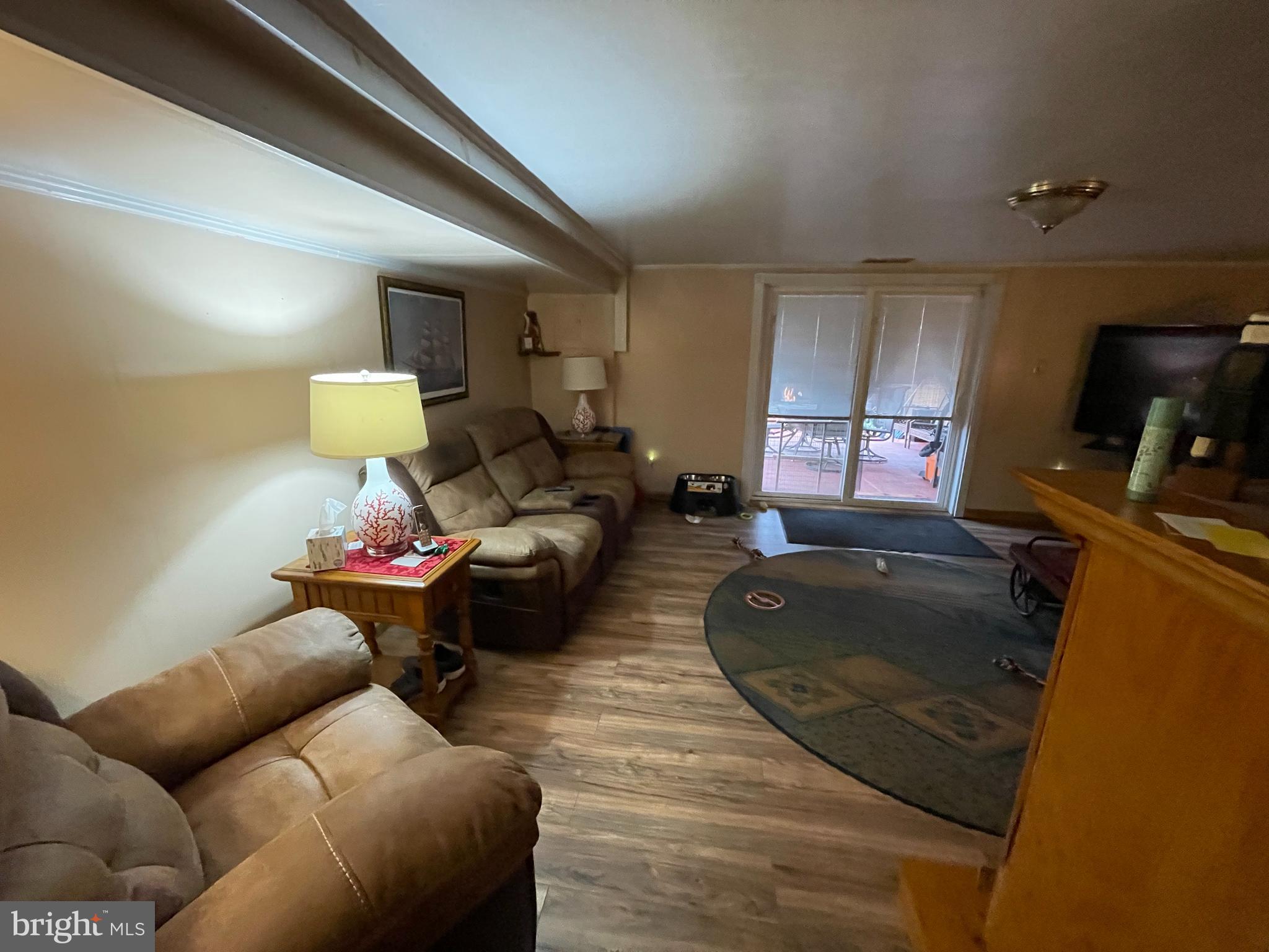 12014 Tyrone Road Philadelphia, PA 19154 - Photo 18 of 32 a living room with furniture and a flat screen tv