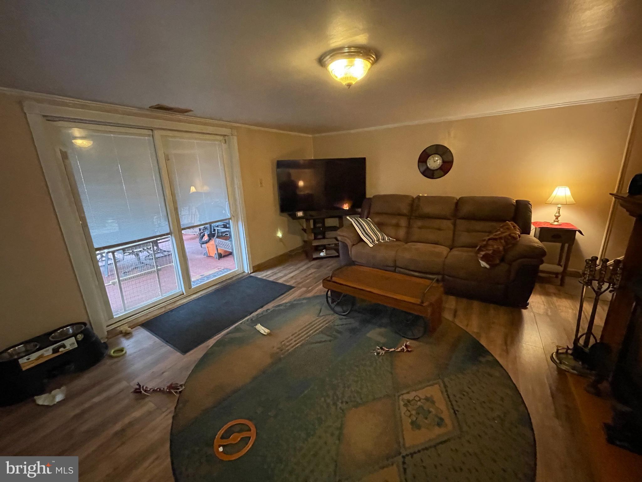 12014 Tyrone Road Philadelphia, PA 19154 - Photo 20 of 32 a living room with furniture and a flat screen tv