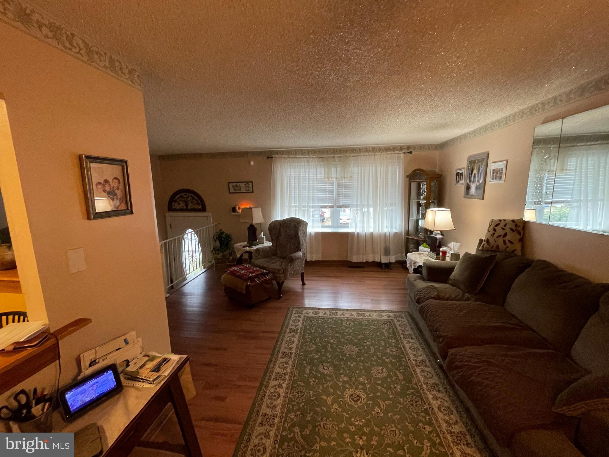 12014 Tyrone Road Philadelphia, PA 19154 - Photo 3 of 32 a living room with furniture and a wooden floor